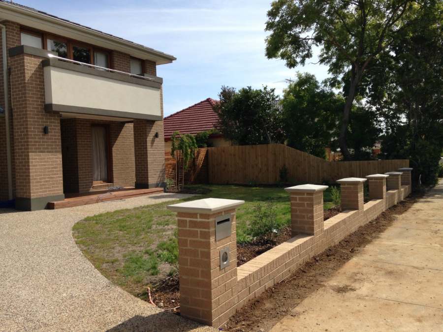 Cream brick piers with letterbox